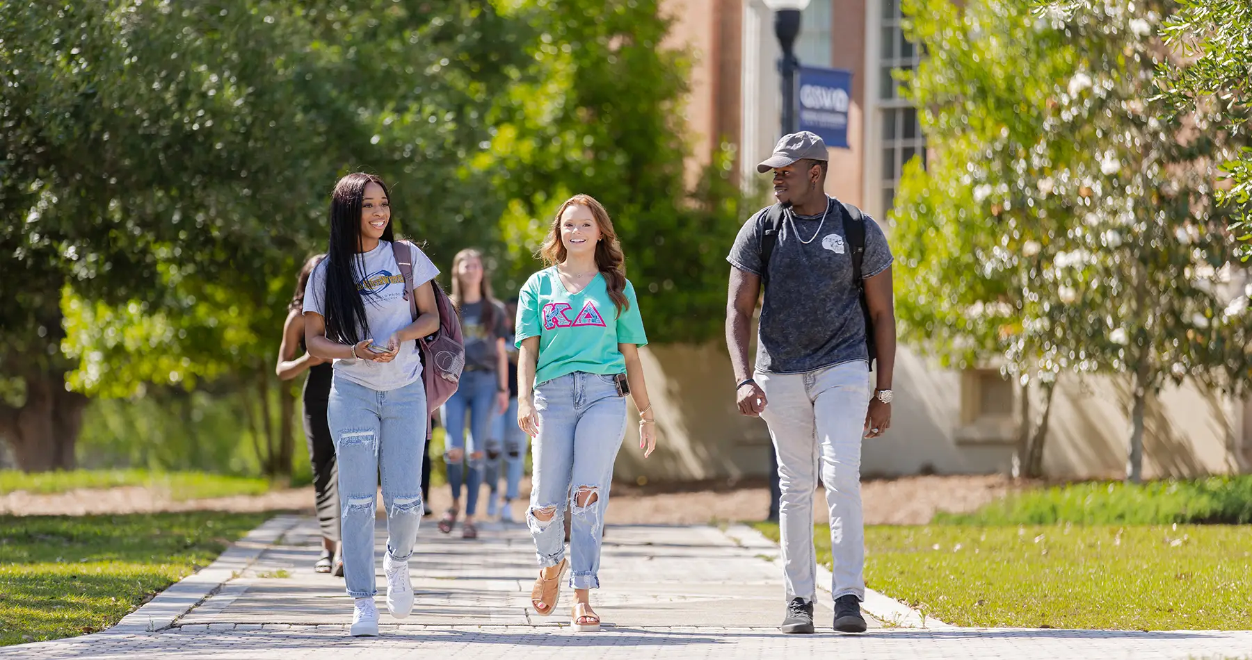Students walking on sidewalk