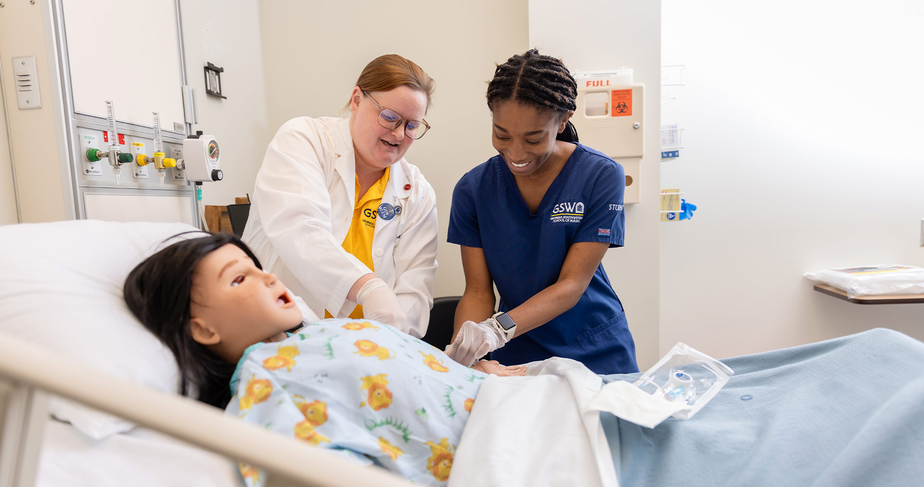 Nursing student working with simulator