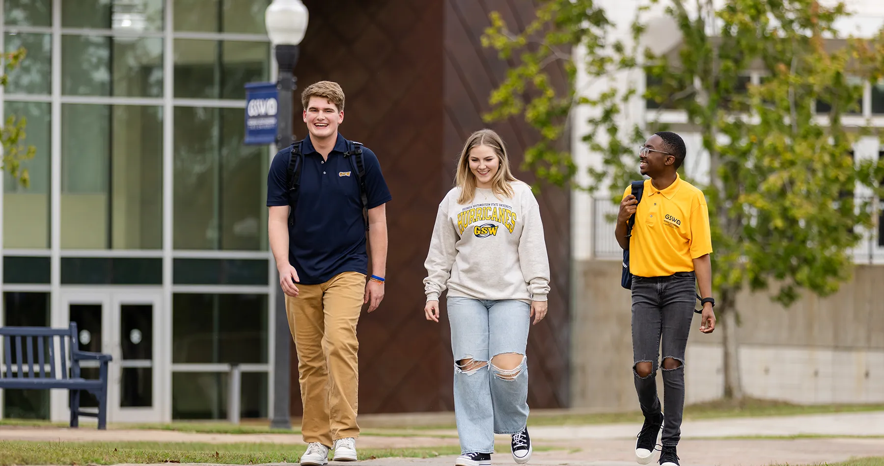 Students walking on sidewalk outside