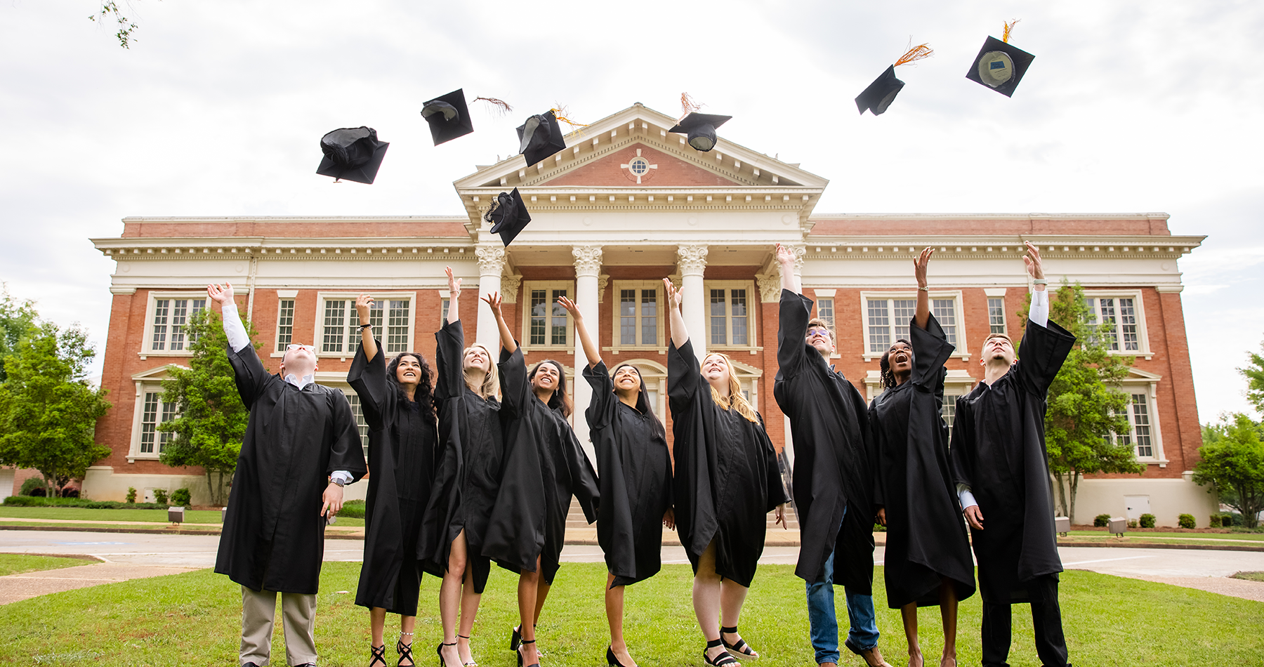 Graduating Students throwing caps