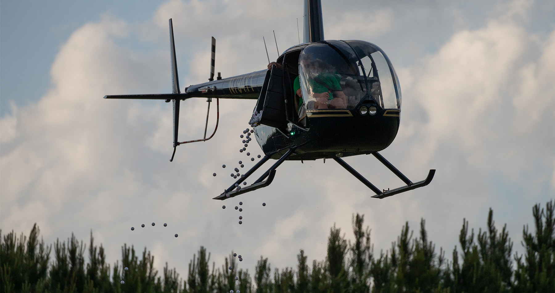 helicopter dropping golf balls