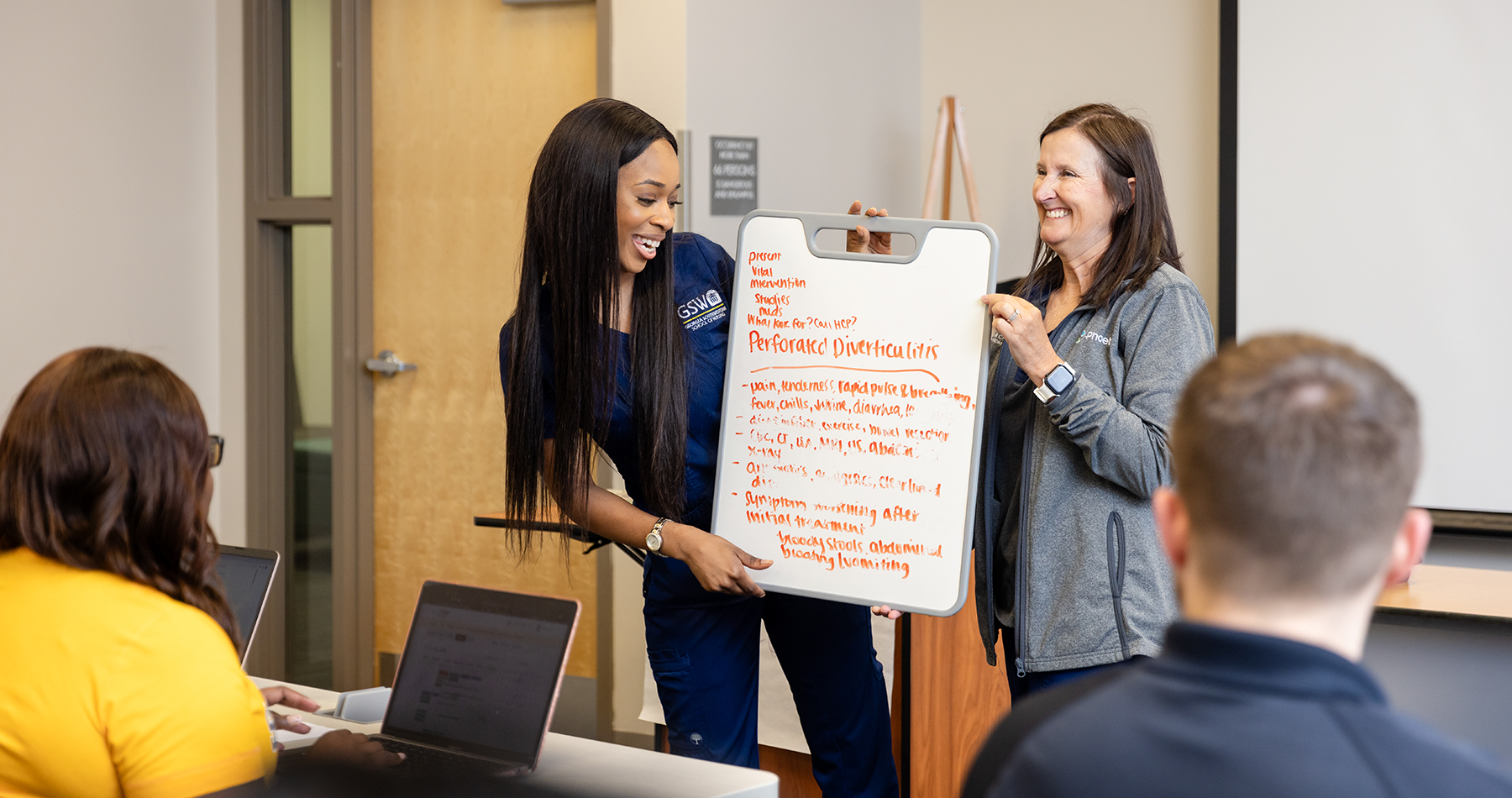 Nursing students teaching class