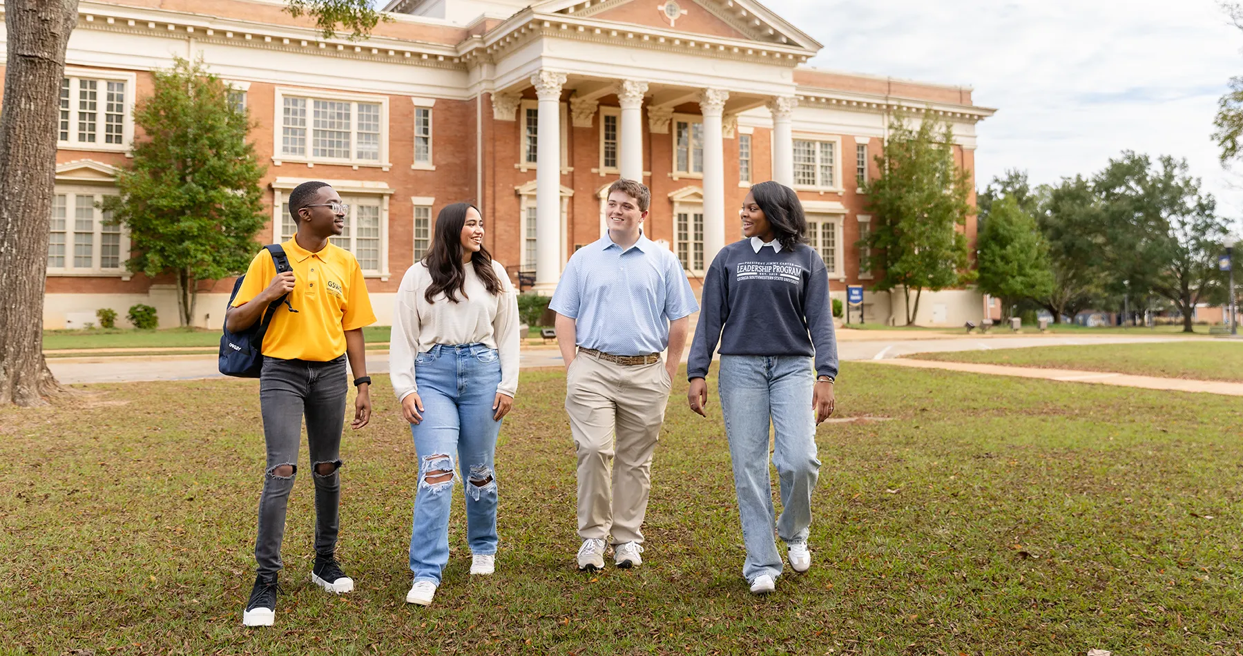 Students walking on campus during fall