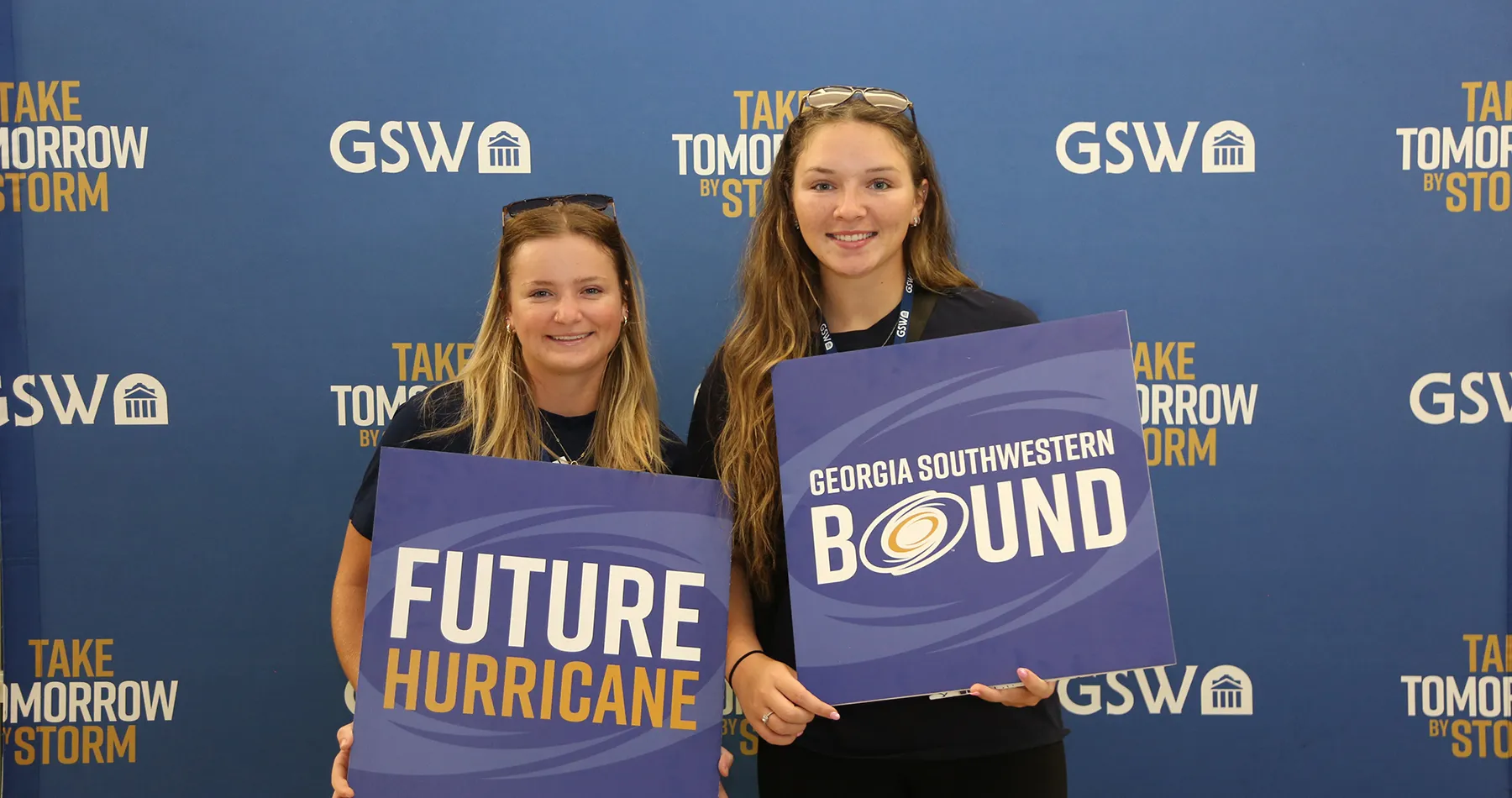 Students at Storm Day holding props