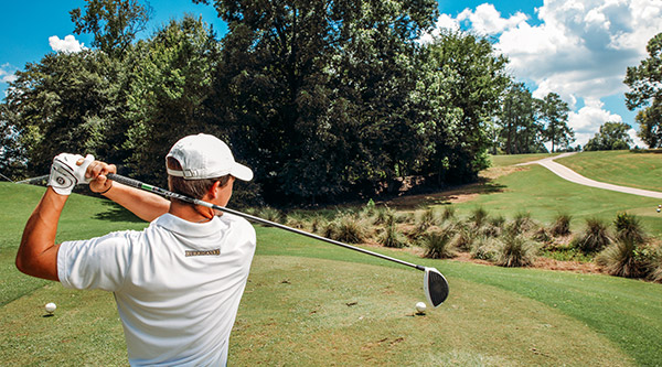 student golfing