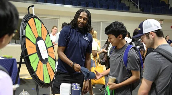 Community engaging with students at Americus Showcase