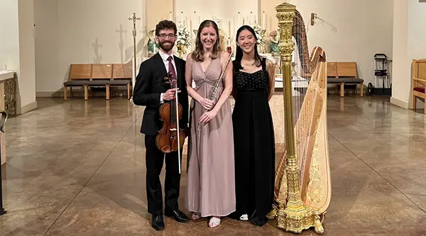 trio of musicians with their instruments