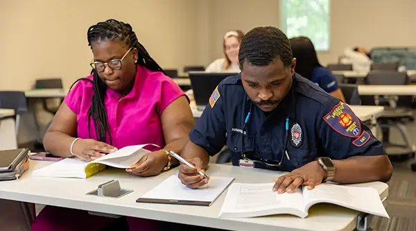 Adult Learners working in class room