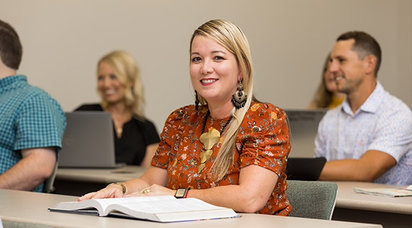 student sitting at table during lecture