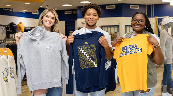 students holding Hurricane gear