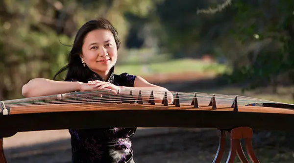 HaiQiong Den with stringed instrument