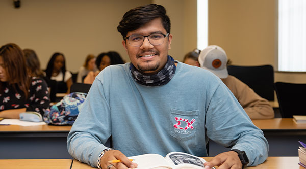 student sitting in classroom