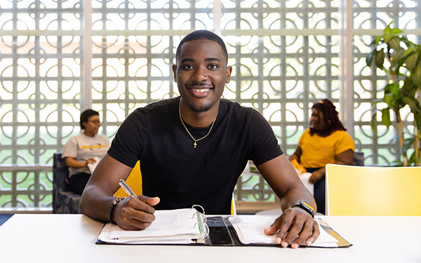 Student with Notebook