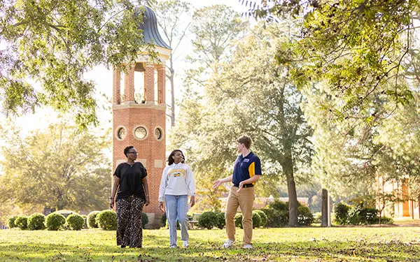 Student and parent touring GSW campus with admissions counselor