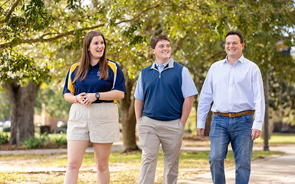 Admissions counselor leading a campus tour