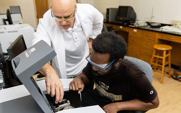 Student using engineering equipment