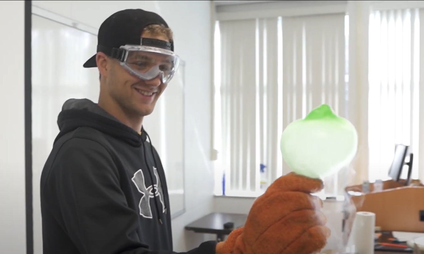 Student holding balloon