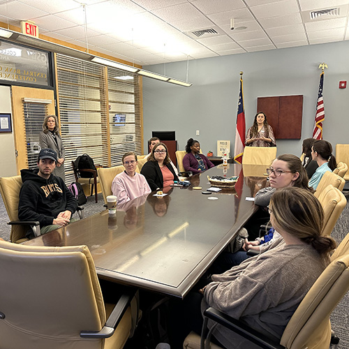 accounting students hear from firm representatives in conference room