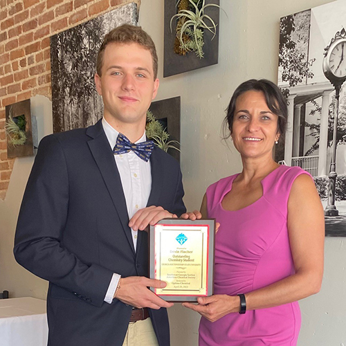 Devin Fincher and Dr. Iordanova with award