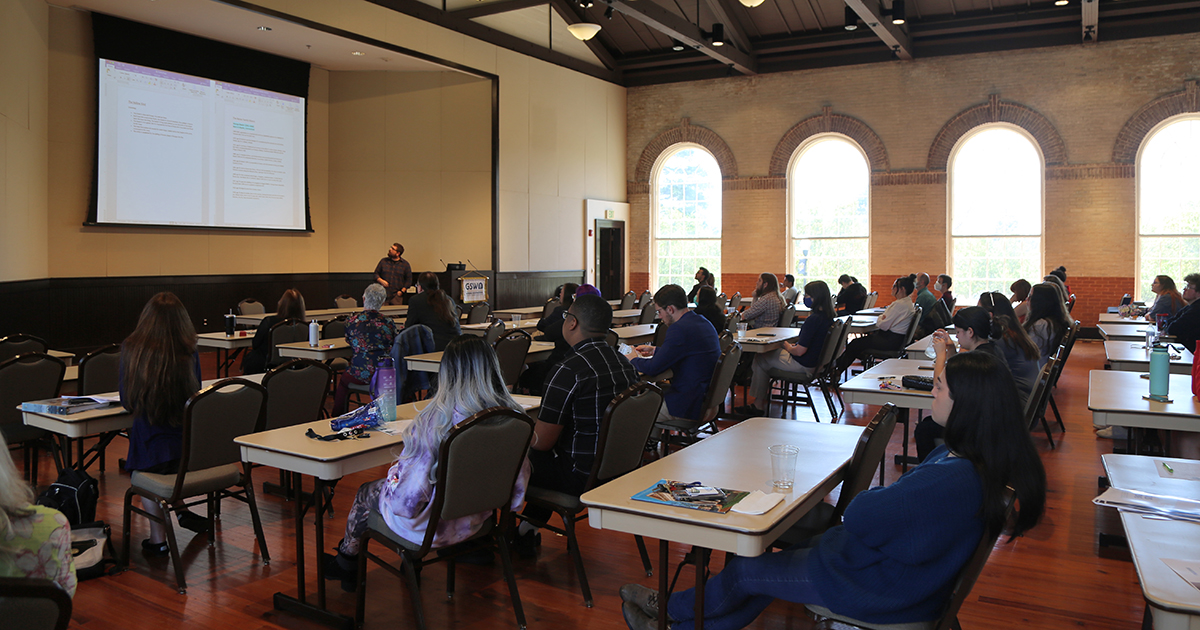 attendees hear from author at symposium