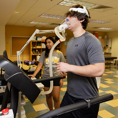 students use exercise science equipment