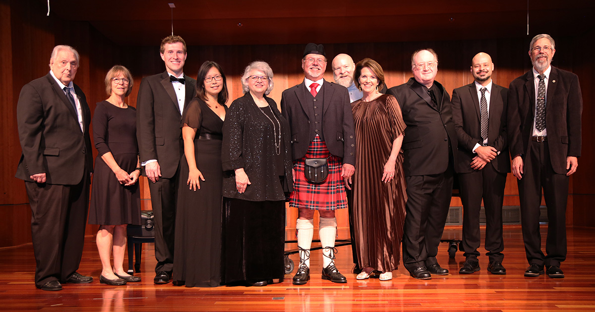 group of musicians on stage before recital