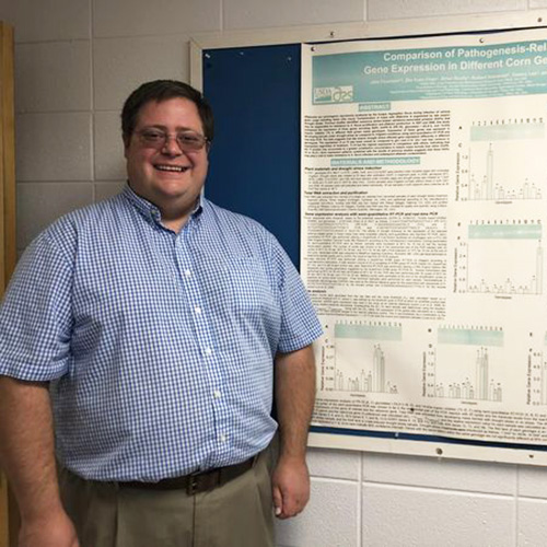 Jake Fountain with his research capstone poster