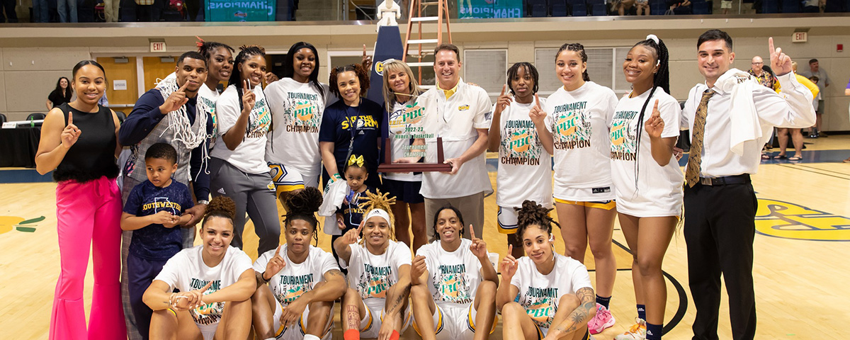 Lady Canes pose with their PBC Tournament trophy