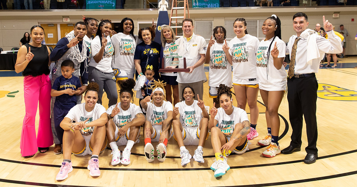 Lady Canes pose with their PBC Tournament trophy