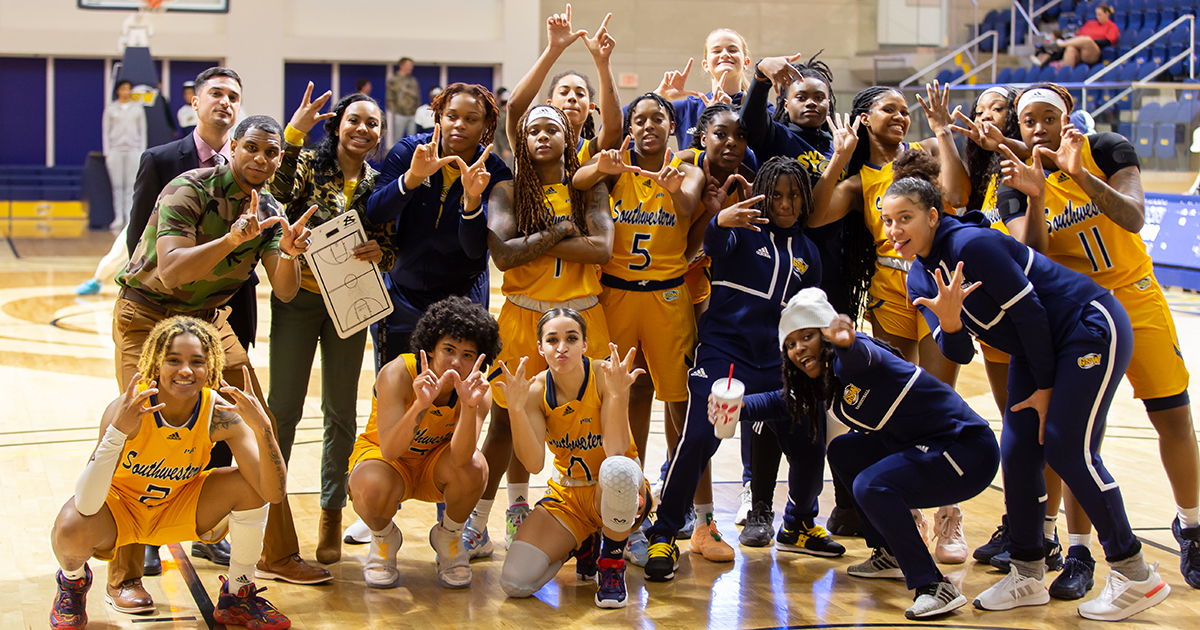 women's basketball team celebrate win