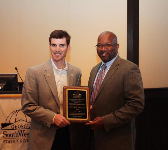 Stephen Snyder with award