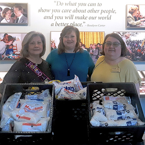 nursing faculty with food donations