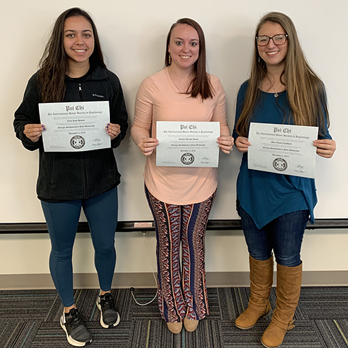 students hold certificates