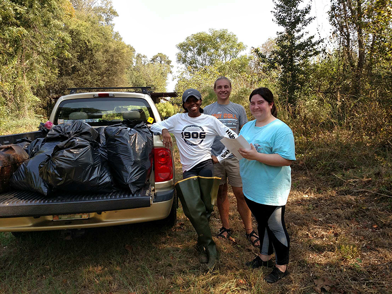 students at river cleanup