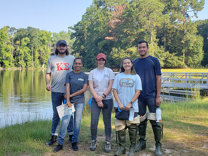 students at river cleanup