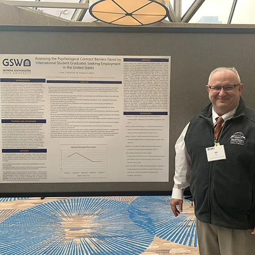 Dr. Jim Aller with poster