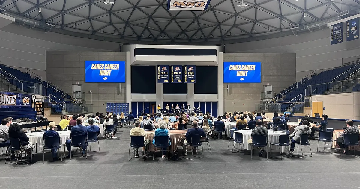 wide angle of attendees at tables