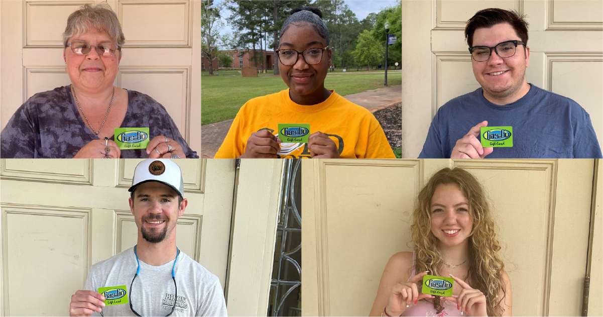 students pose with their gas gift cards