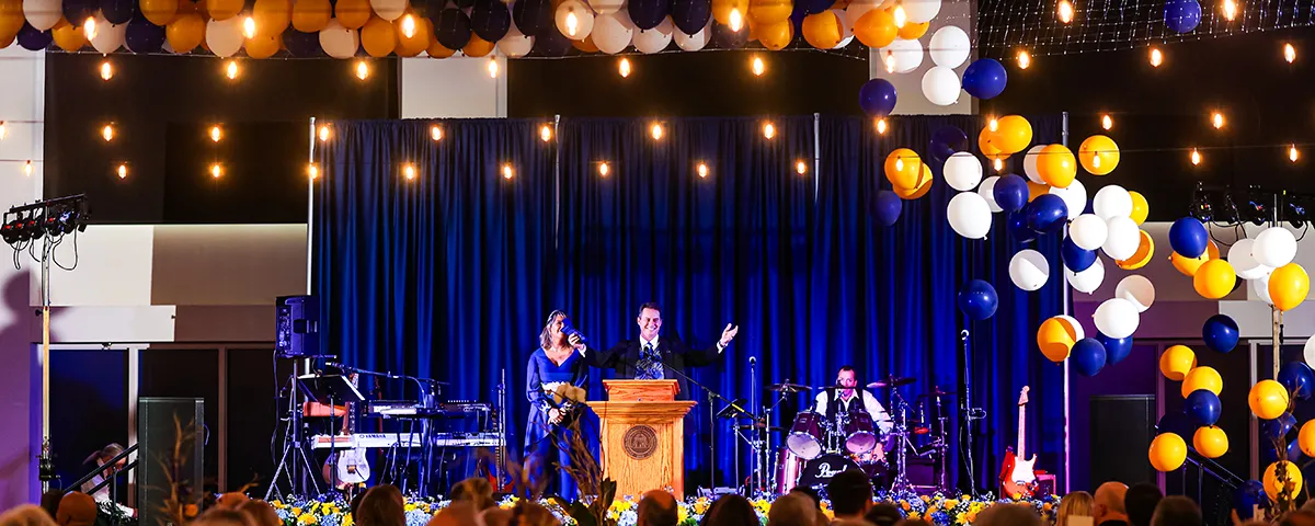 balloons fall as Dr. Weaver makes announcement