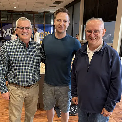 student with faculty members