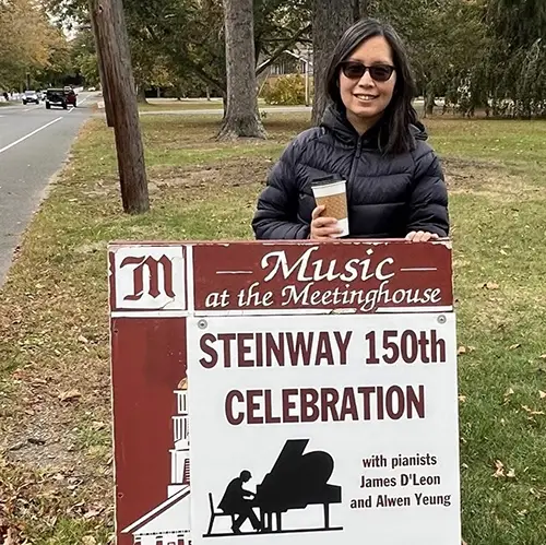 Alwen Yeung in front of sign for Steinway event