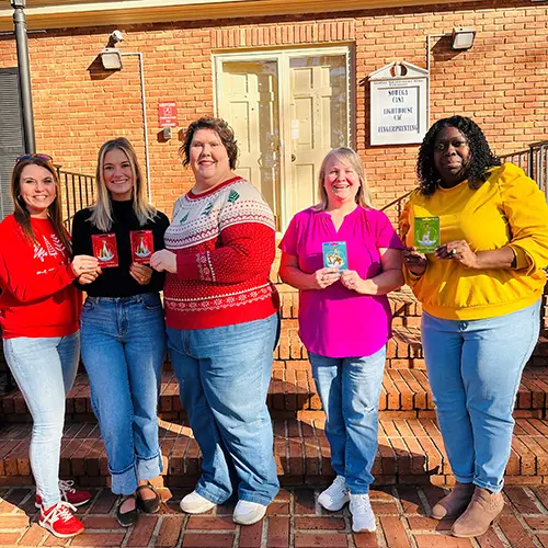 staff present gift cards to CASA reps