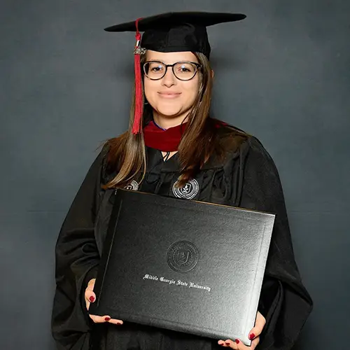Sydney Scott in graduation regalia