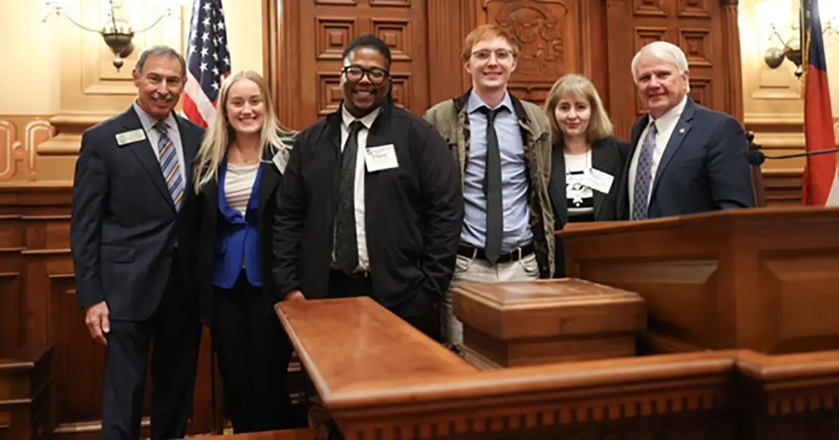 students pose with politicians 