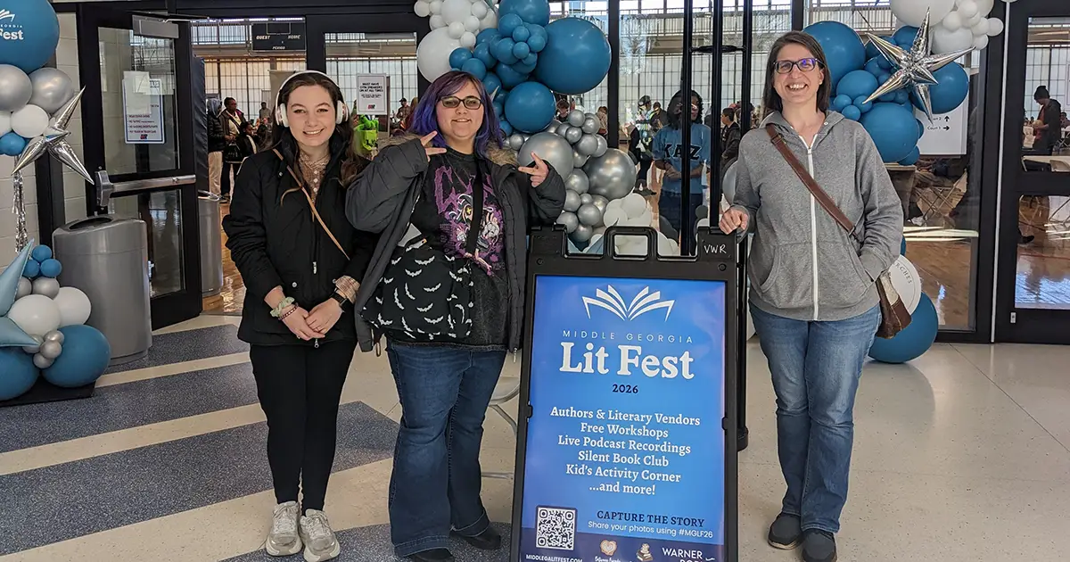 people in front of festival signage