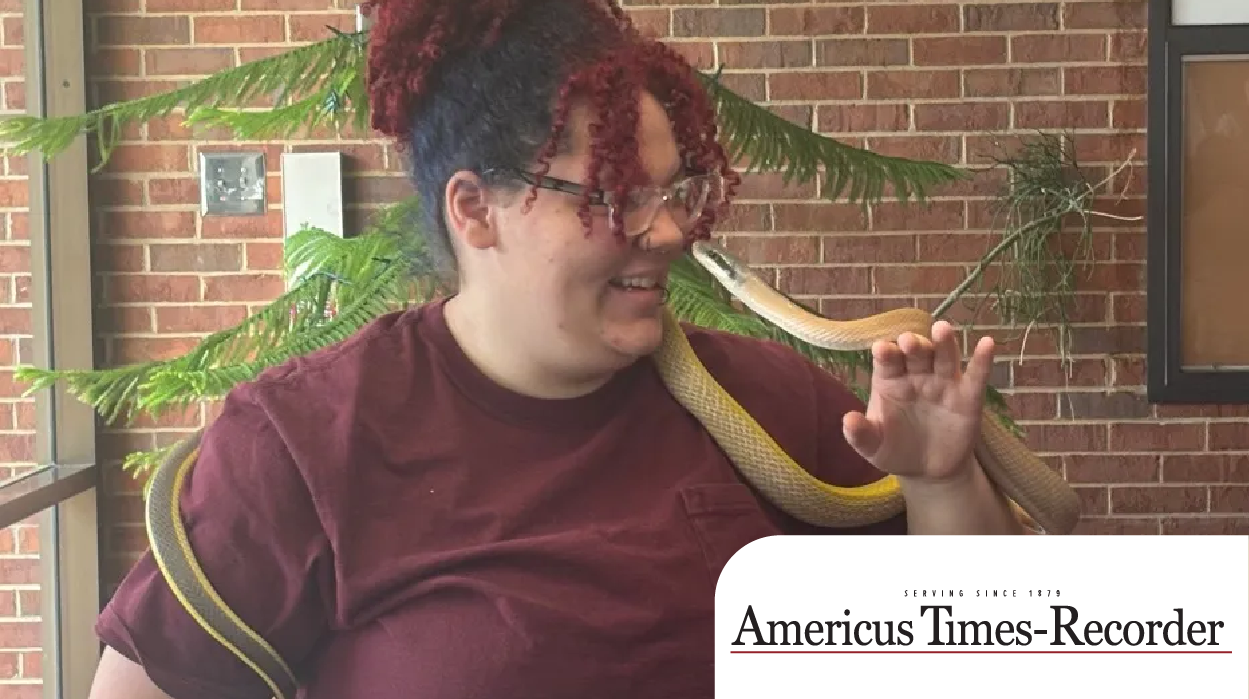 student holds snake