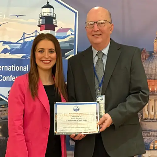 Brian Mallett accepts award