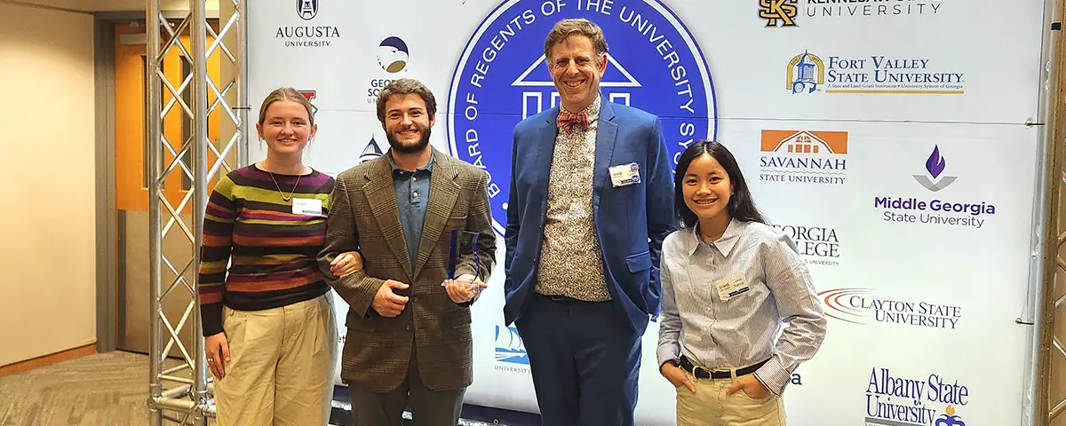 students and faculty at debate