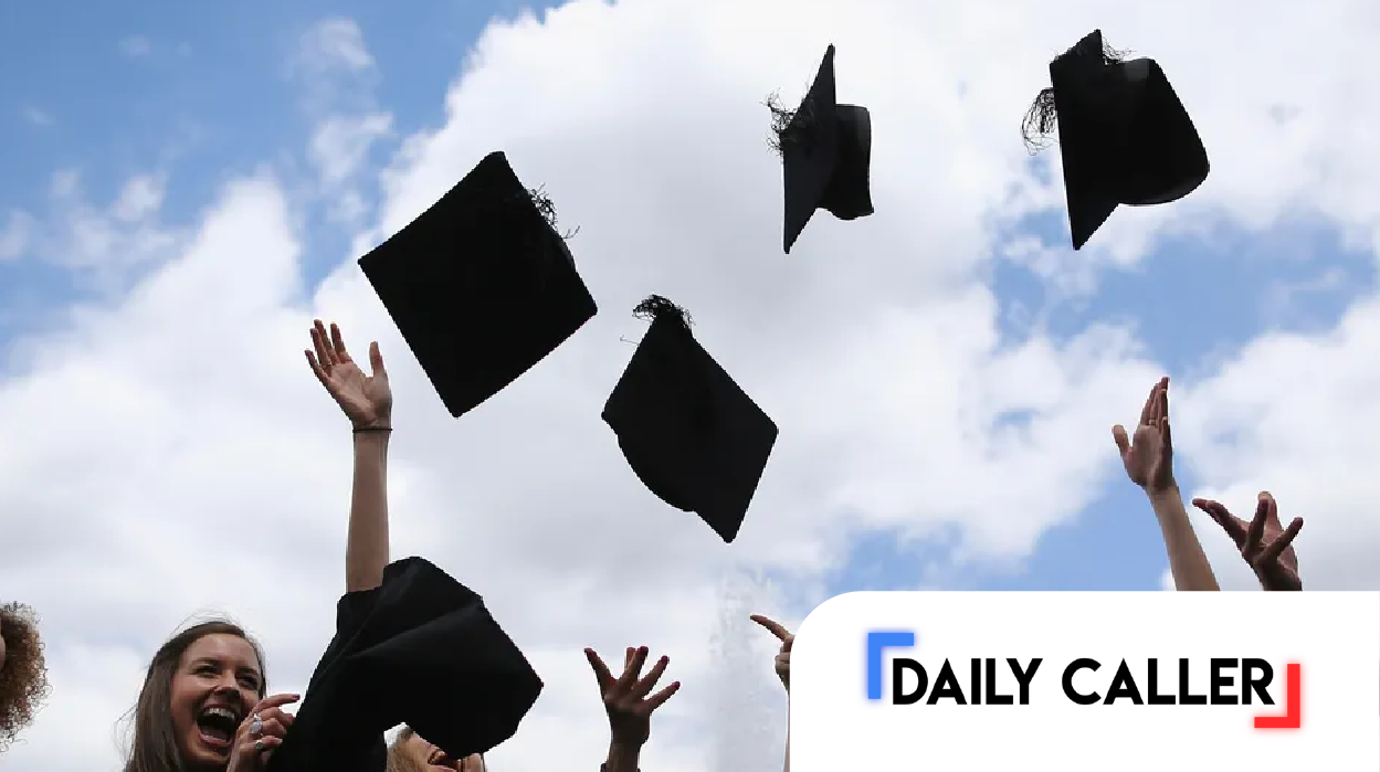 stock image of graduates throwing caps