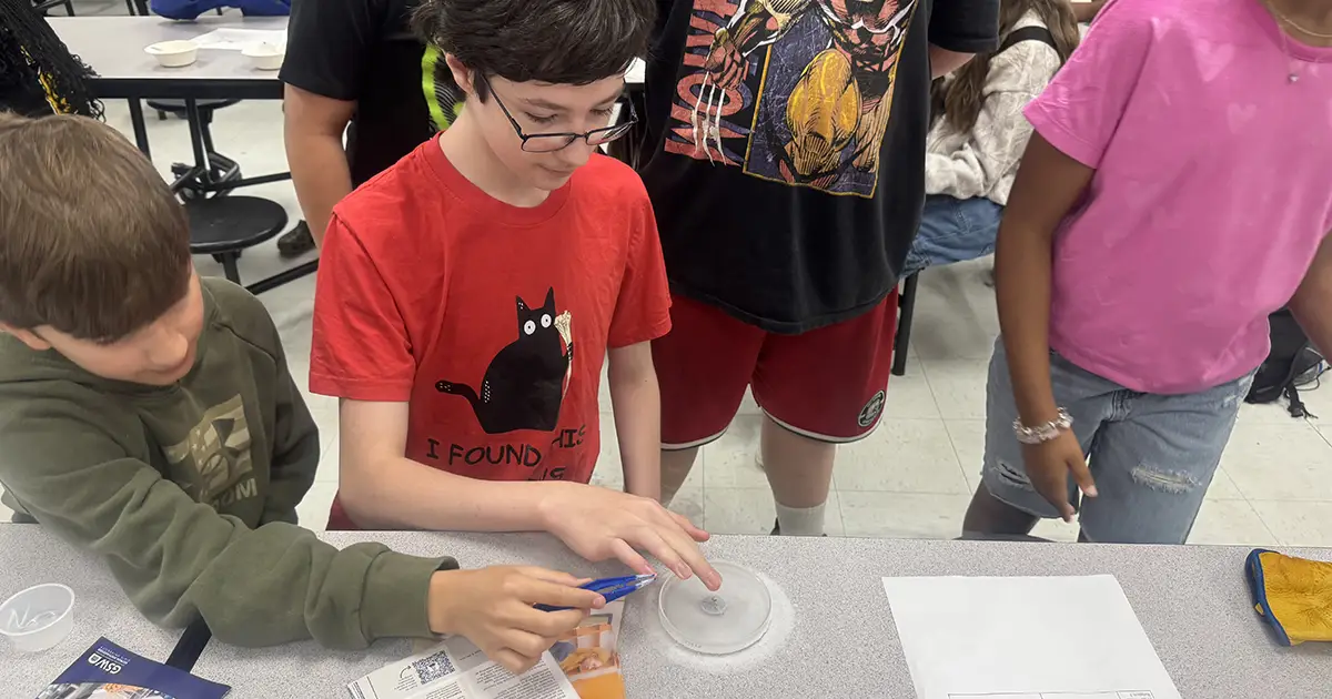 boys participate in science experiment
